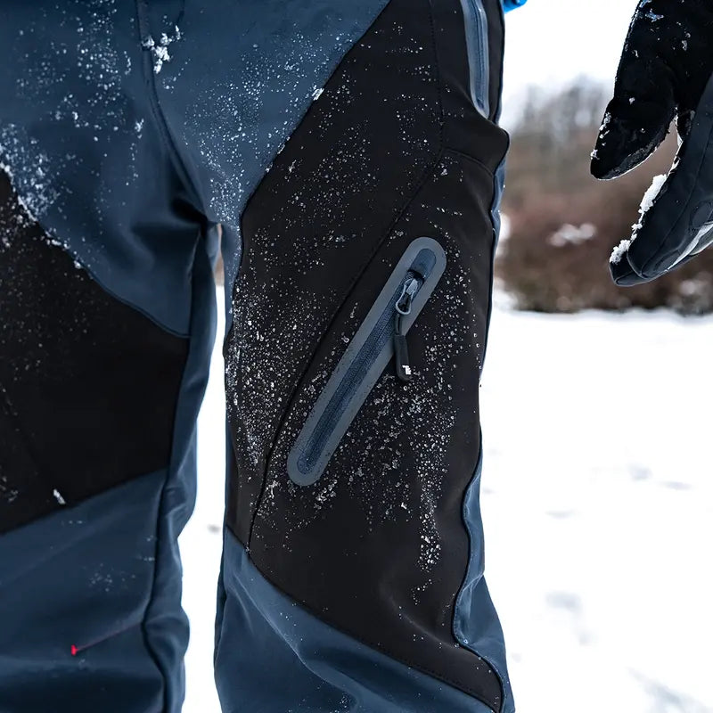 Zippered outdoor pants pocket in snowy winter conditions