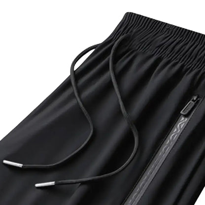 Elastic waistband, drawstring and zipper pocket detail