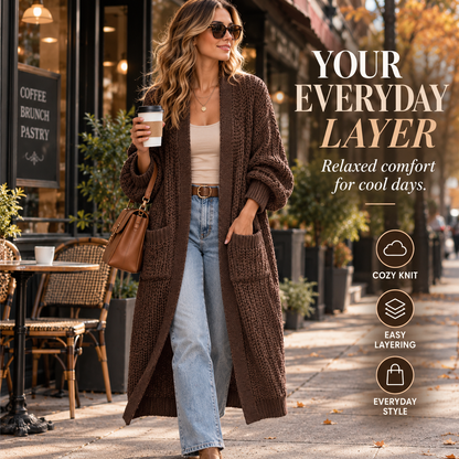 Woman wearing dark brown long knit cardigan in an autumn city cafe setting